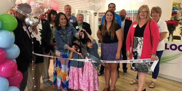 ribbon cutting for Isa Balloon Design and More