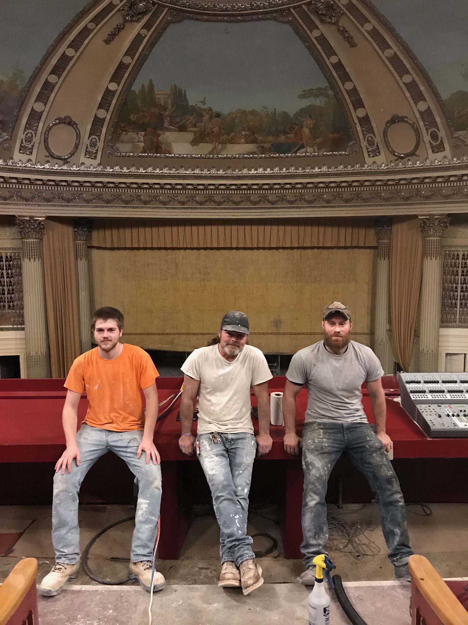 Artists from left: Ethan Wallace, Corey Wallace, and Tony Cavallo, inside the theater.