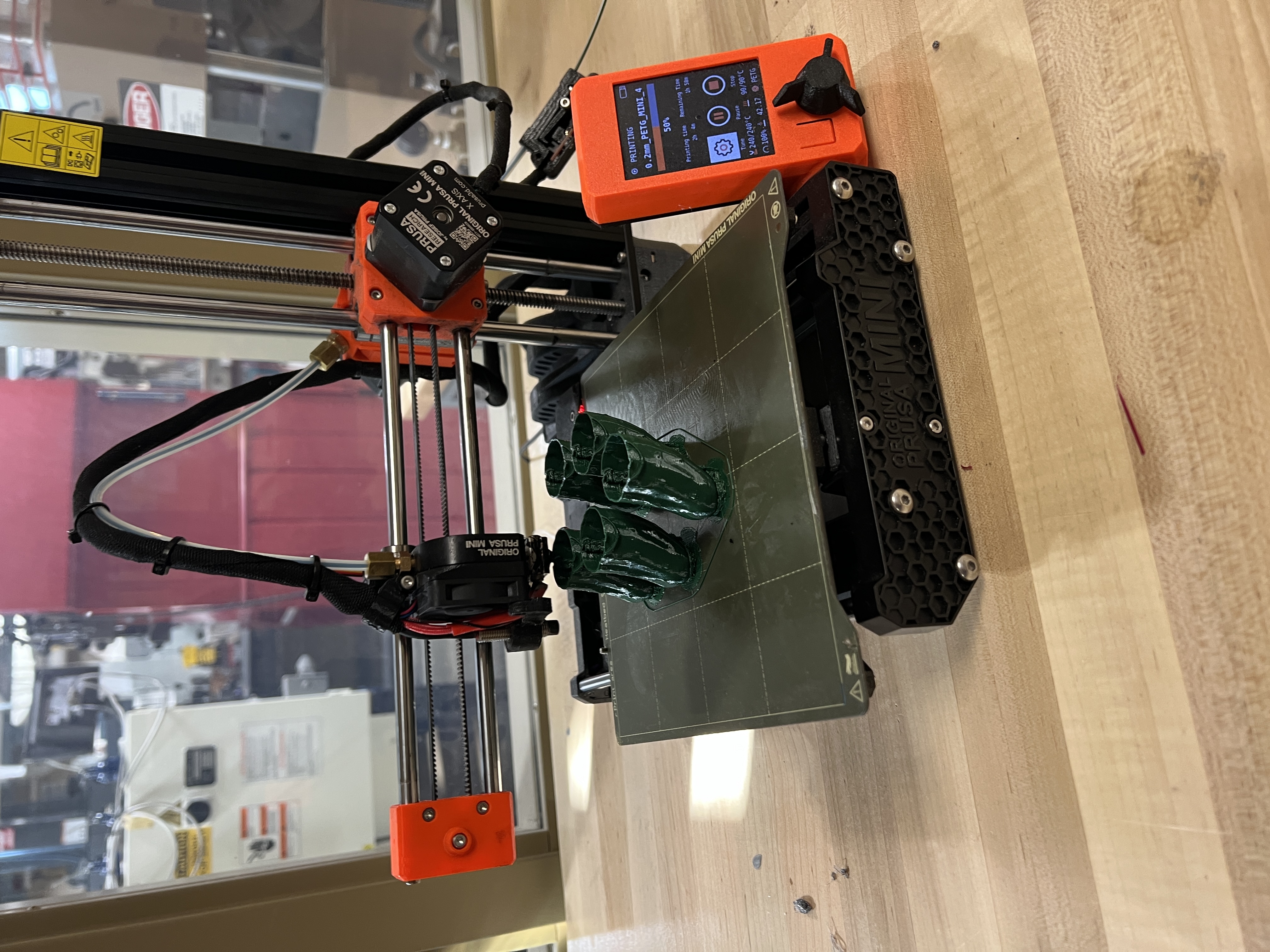 pickle ornaments being made by 3-D printer at WIU